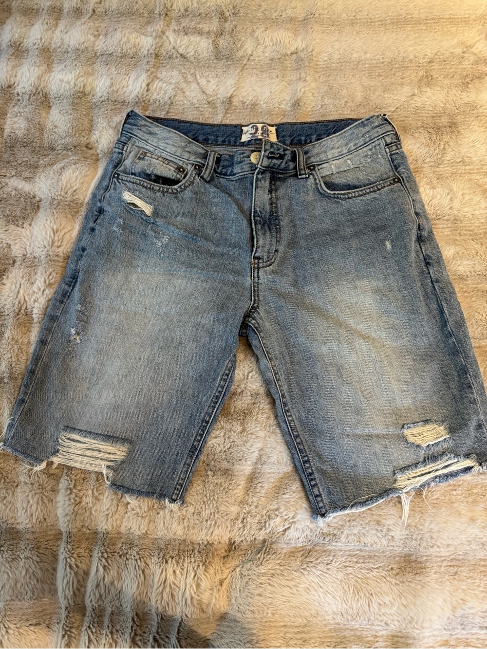 Free People "We The Free"  distressed mid-rise shorts